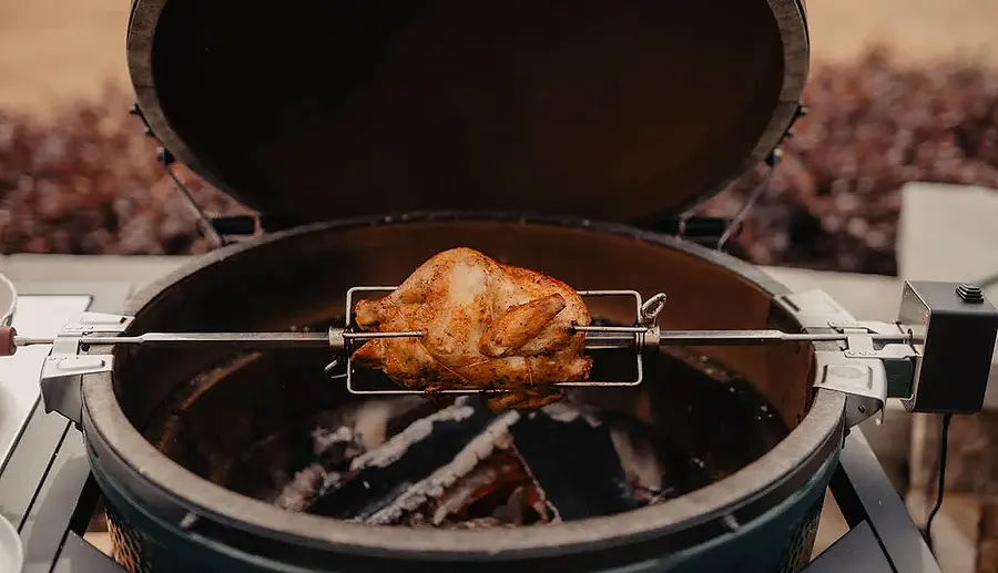 big-green-egg-rotisserie-whole-chicken-cook.webp